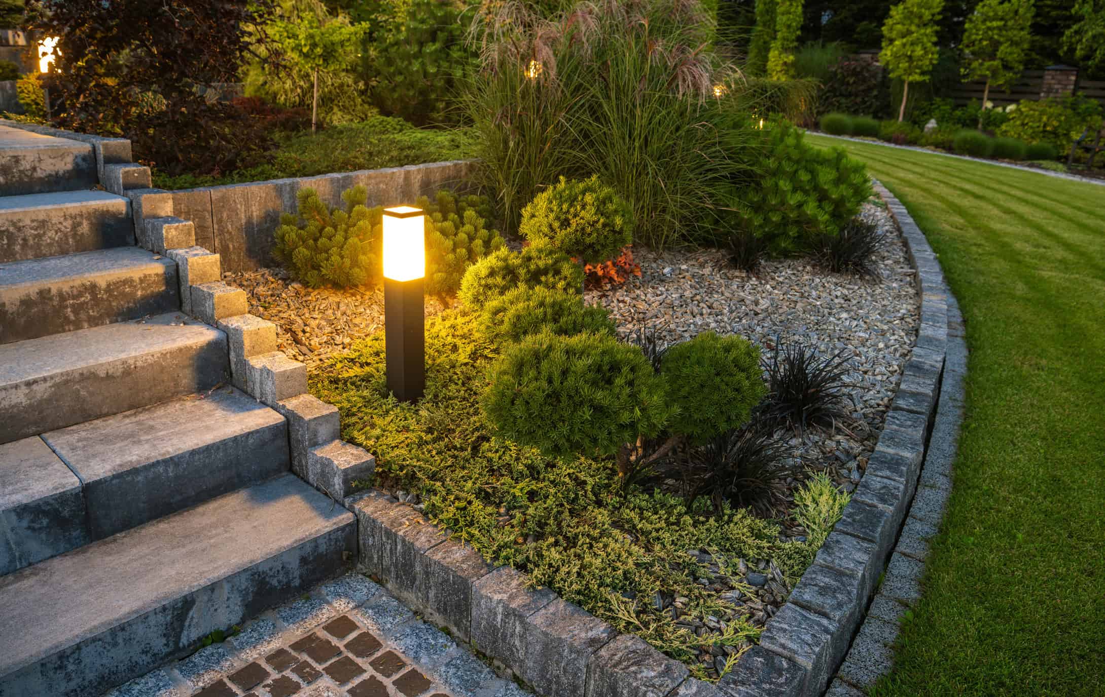 Low-voltage path and walkway lighting along a front walk in Willow Spring, NC