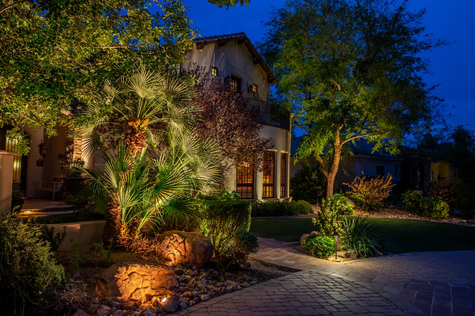 FX Luminaire Luxor ZDC color lighting along a driveway and front landscape at night
